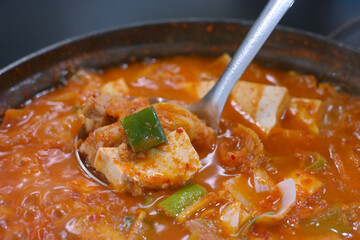 Over-fermented kimchi boiled with pork, bean curd, and green onion. Often considered Korean “soul food,” this spicy kimchi stew strikes a perfect balance with the greasy pork.