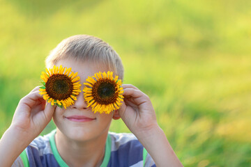 child with sunflower