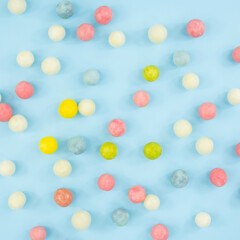 Mint chewable candies on a blue background. Colored sweet candies top view. sweets