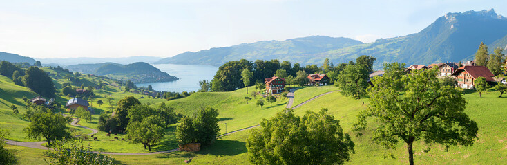 idyllic rural landscape tourist resort Krattigen, view to Niederhorn mountain and lake Thunersee