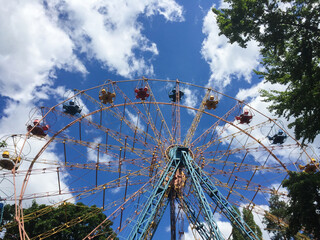 Ferris wheel in the park on a summer day. Closeup.