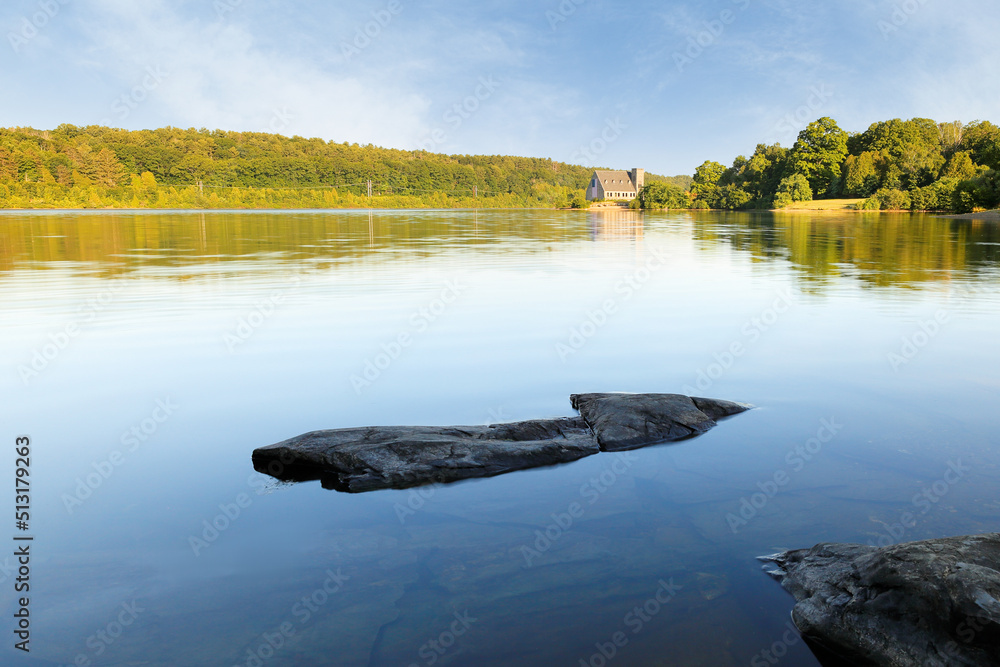 Wall mural the old stone church and wachusett reservoir at west boylston at sunrise, massachusetts. the church,