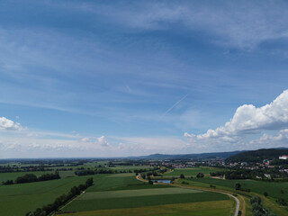 Fototapeta na wymiar Aerial view of an agricultural field with grain planted in spring in Bavaria