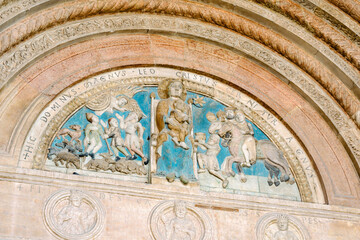 Verona, Italy - lunette decorated with polychrome reliefs depicting the Madonna enthroned with...