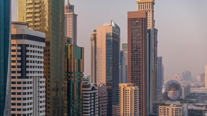 Fototapeta na wymiar Aerial view of Dubai International Financial District with many skyscrapers timelapse.