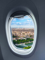 view of the city through the aircraft porthole - 513180089
