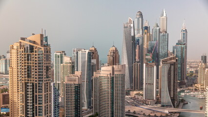 Fototapeta na wymiar View of various skyscrapers in tallest recidential block in Dubai Marina aerial timelapse