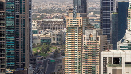 Fototapeta na wymiar Dubai Marina and Media City districts with modern skyscrapers and office buildings aerial timelapse.