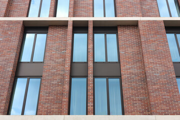 Modern red brick building with beautiful windows
