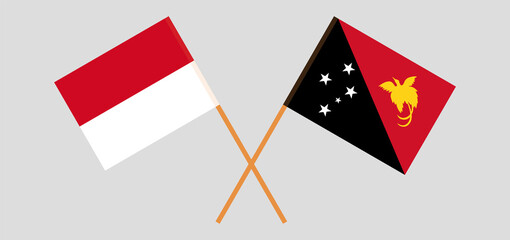Crossed flags of Monaco and Papua New Guinea. Official colors. Correct proportion
