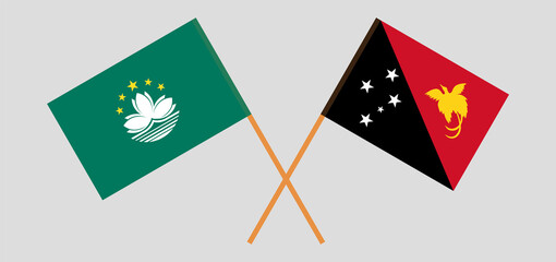 Crossed flags of Macau and Papua New Guinea. Official colors. Correct proportion