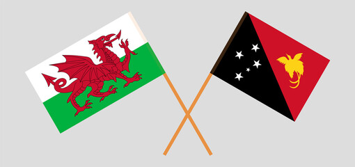 Crossed flags of Wales and Papua New Guinea. Official colors. Correct proportion