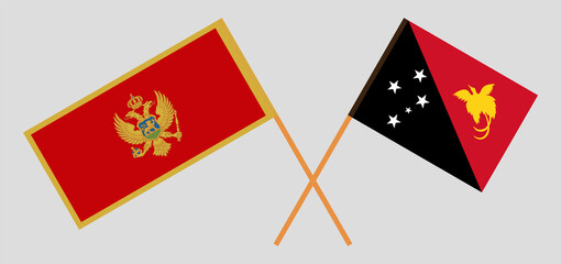 Crossed flags of Montenegro and Papua New Guinea. Official colors. Correct proportion