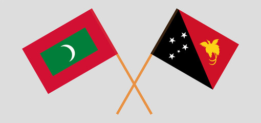 Crossed flags of Maldives and Papua New Guinea. Official colors. Correct proportion
