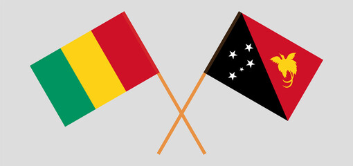 Crossed flags of Guinea and Papua New Guinea. Official colors. Correct proportion