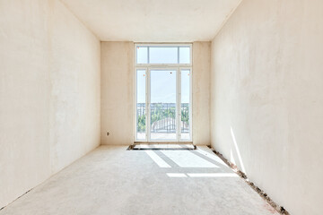 Interior of new apartment without finishing in gray tones