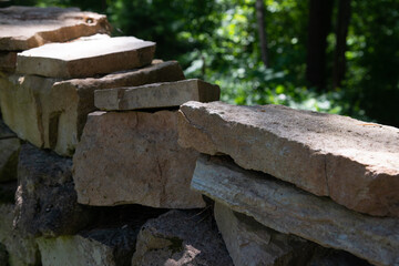 Stack of stones. Stone stack wall in the forest.