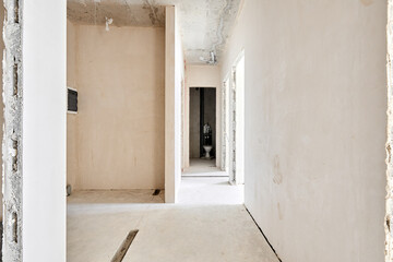 Interior of new apartment without finishing in gray tones