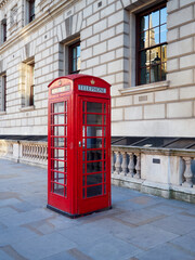 Red telephone box, typical British phone booth, in London, England, UK
