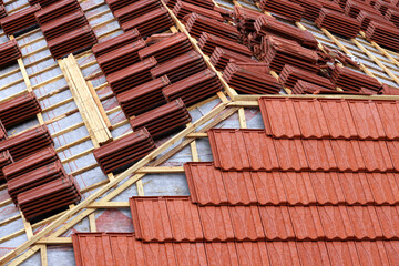 Obraz na płótnie Canvas Roofing construction. Wooden roof frame during house construction. Focus on the front planks.