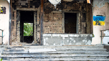BUCHA, UKRAINE - June 20, 2022: the consequences of the aggression of the Russian army: shot, bombed, burned apartments and houses