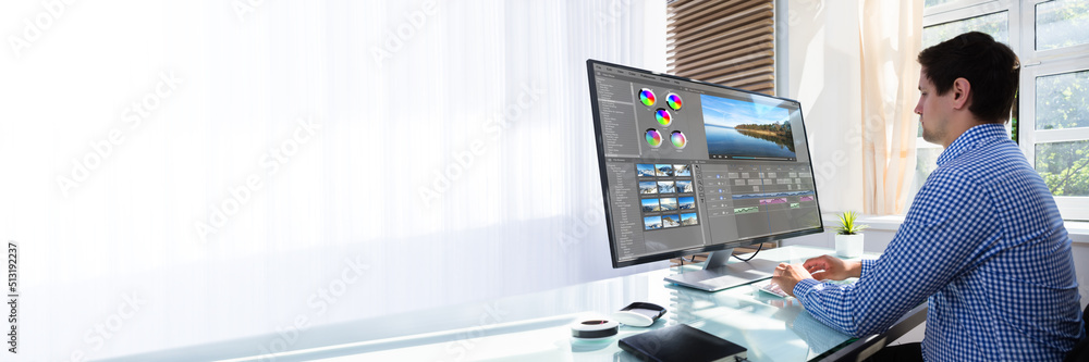 Poster editor editing video on computer