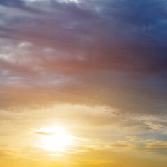 Naklejka na ściany i meble dramatic sunset on cloudy sky background