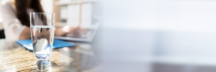 Glass Of Water On Desk