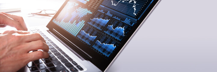 Businessman Analyzing Graph On Laptop