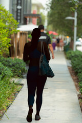 woman walking in the city morning miami shopping summer 