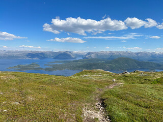 Fototapeta na wymiar Hiking to the mountains Seterfjellet a warm and beautiful summer day , Northern Norway- Europe 