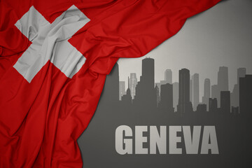 abstract silhouette of the city with text Geneva near waving national flag of switzerland on a gray background.