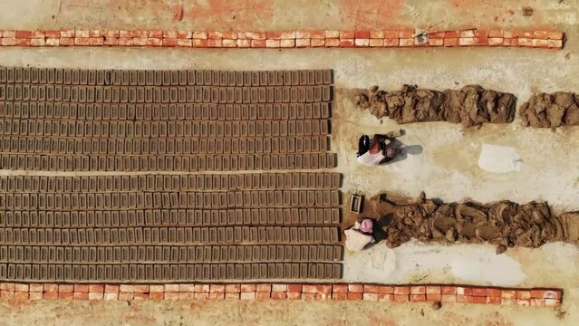 Brick field workers in bangladesh. Making bricks from mud.