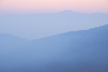 Soft pink and blue hues in an Appalachian mountain scene