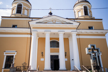 entrance to a large catholic church with white columns