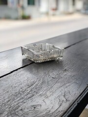 ashtray on wooden table, street view