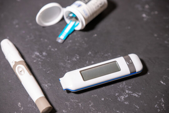 Glucometer Kit Drawn On Black Textured Background