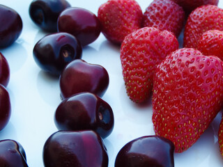 Berry mix. Strawberries and cherries on a white background.