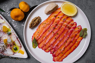 Fresh raw salmon fillet with seasonings, Rustic style. selective focus