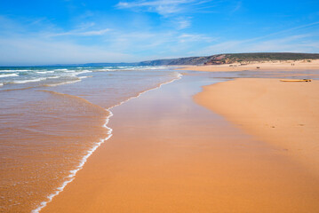 sandy bay Praia do Bordeira with outgoing waves, portugal coast algarve - obrazy, fototapety, plakaty