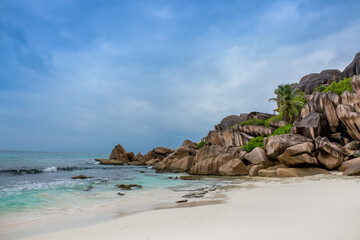 Beautiful nature of the sea tropical landscape. Exotic tropical nature of the Seychelles, a white beach surrounded by palm trees and granite rocks.