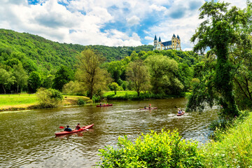 Obernhof at the Lahn with Kloster Arnstein on the hill . Beautyful landscape with river and boats...