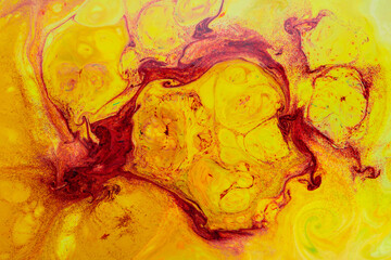 Fluid Art. Abstract liquid orange-red colors paint background. Trendy golden orange backdrop. Liquid art concept