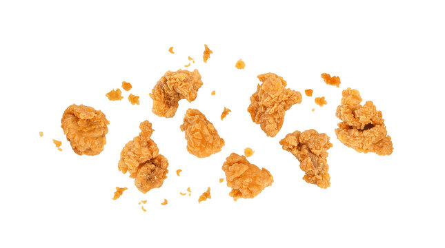 Fried popcorn chicken with crumbs isolated on white background. Top view