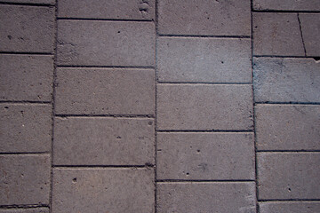 The texture of gray tiles in a warm shade