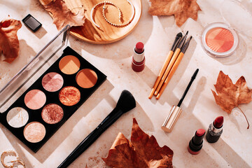 Autumn skincare and autumn makeup concept with beauty products on table - obrazy, fototapety, plakaty