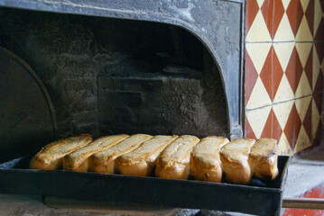 Freshly baked bread in a traditional oven