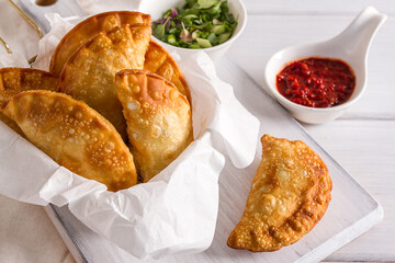 Fried chebureks, close-up, on a white background, no people,