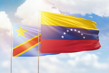 Sunny blue sky and flags of venezuela and dr congo