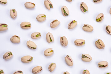 Obraz premium pistachios on a white background close-up